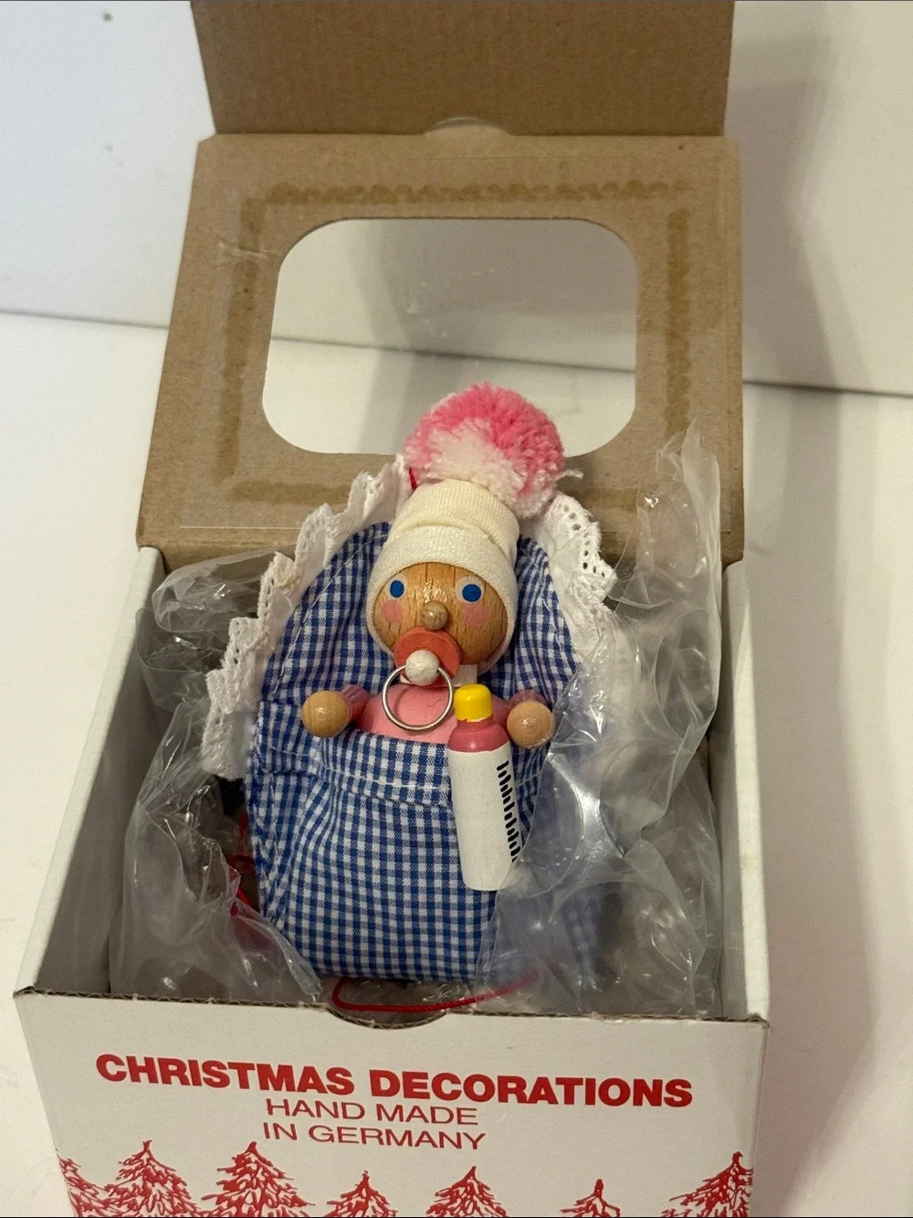STEINBACH German Baby girl Ornament with bottle, pacifier & Blue Gingham Blanket